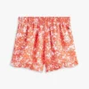 Calções com folhos e estampado tropical para criança Calções com folhos e estampado tropical para criança