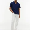 Camisa polo com bolso em malha e corte regular Camisa polo com bolso em malha e corte regular