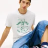Camiseta Tommy Jeans com logotipo Weightlifter Camiseta Tommy Jeans com logotipo Weightlifter