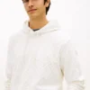 Camisola com capuz em veludo jacquard com logótipo de bandeira por todo o lado Camisola com capuz em veludo jacquard com logótipo de bandeira por todo o lado