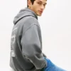 Camisola com capuz Tommy Jeans com logótipo pintado com spray Camisola com capuz Tommy Jeans com logótipo pintado com spray
