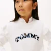 Camisola infantil com lantejoulas, logótipo e folhos Camisola infantil com lantejoulas, logótipo e folhos