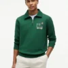 Camisola polo com fecho de correr de um quarto e logótipo floral Camisola polo com fecho de correr de um quarto e logótipo floral