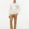 Camisola polo com fecho de correr de um quarto e logótipo floral Camisola polo com fecho de correr de um quarto e logótipo floral