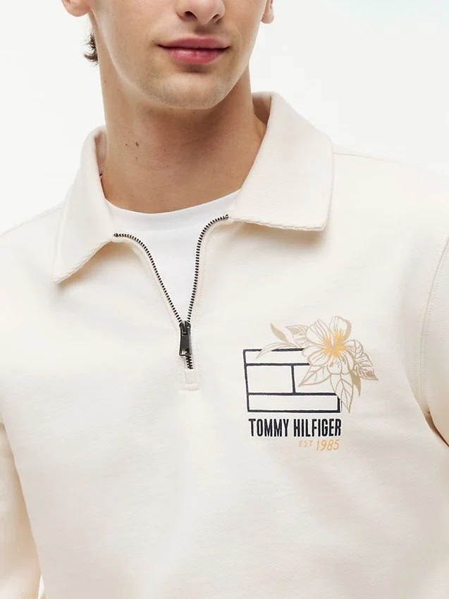 Camisola polo com fecho de correr de um quarto e logótipo floral Camisola polo com fecho de correr de um quarto e logótipo floral