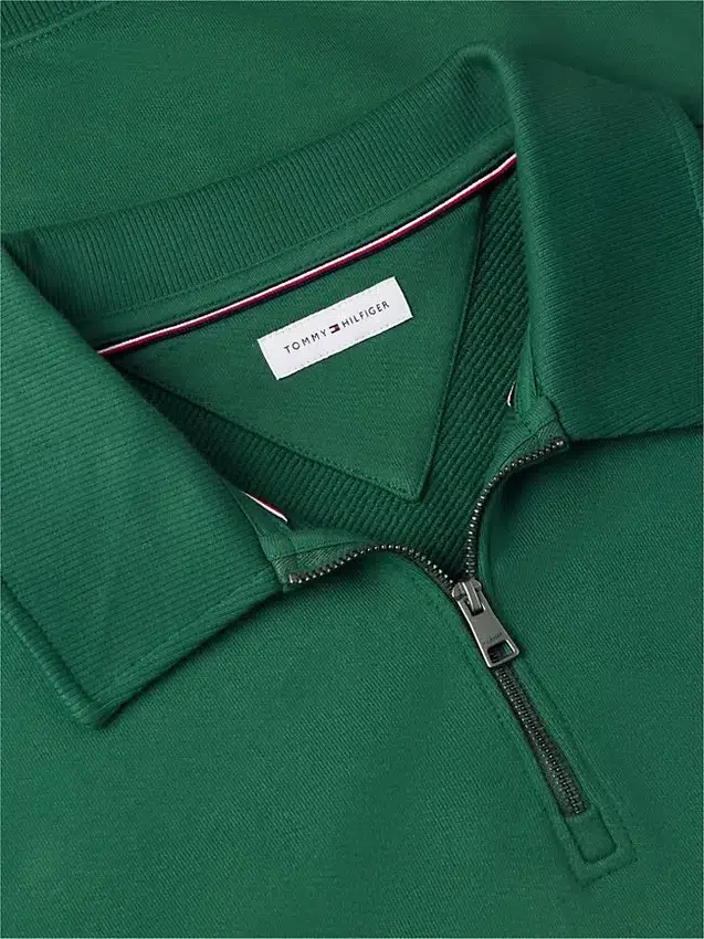 Camisola polo com fecho de correr de um quarto e logótipo floral Camisola polo com fecho de correr de um quarto e logótipo floral