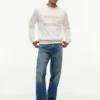Camisola Raglan com logótipo da bandeira e interior escovado Camisola Raglan com logótipo da bandeira e interior escovado