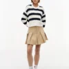 Camisola Tommy Jeans com malha de cordões às riscas Camisola Tommy Jeans com malha de cordões às riscas