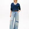 Camisola Tommy Jeans de corte descontraído com decote em V Camisola Tommy Jeans de corte descontraído com decote em V