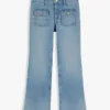 Jeans largos com bolsos de remendo para criança Jeans largos com bolsos de remendo para criança