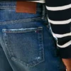 Jeans largos com efeito desgastado Jeans largos com efeito desgastado