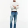 Jeans slim desbotados com elasticidade Jeans slim desbotados com elasticidade