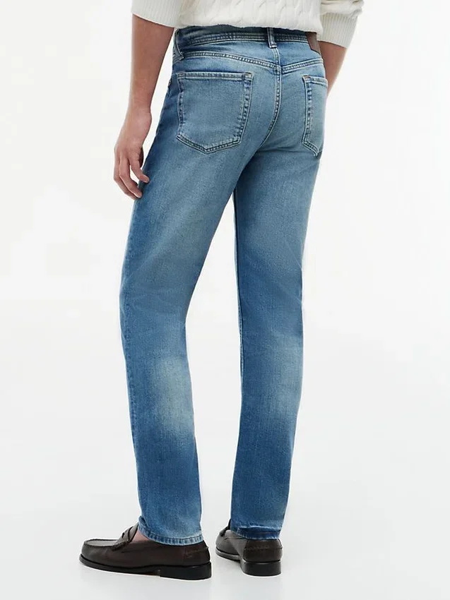 Jeans slim desbotados com elasticidade Jeans slim desbotados com elasticidade