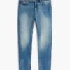 Jeans slim desbotados com elasticidade Jeans slim desbotados com elasticidade