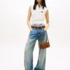 Jeans Tommy Jeans com efeito desgastado e corte reto Jeans Tommy Jeans com efeito desgastado e corte reto