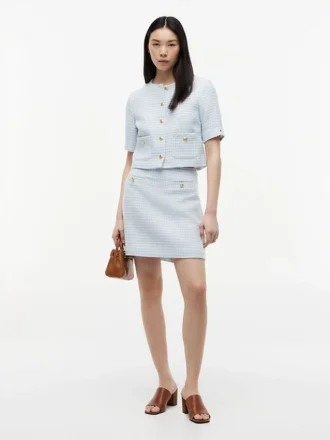 Mini-saia de tweed com botões dourados