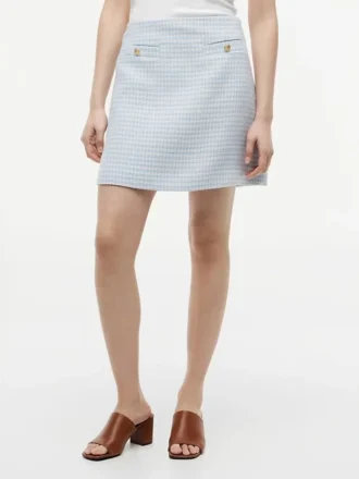 Mini-saia de tweed com botões dourados