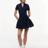 Mini-vestido polo de materiais mistos da Tommy Jeans Mini-vestido polo de materiais mistos da Tommy Jeans