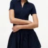 Mini-vestido polo de materiais mistos da Tommy Jeans Mini-vestido polo de materiais mistos da Tommy Jeans