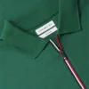 Polo com fecho em algodão liso de corte regular Polo com fecho em algodão liso de corte regular