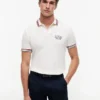Polo de algodão liso com acabamento nas pontas, corte regular Polo de algodão liso com acabamento nas pontas, corte regular
