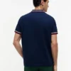 Polo de algodão liso com acabamento nas pontas, corte regular Polo de algodão liso com acabamento nas pontas, corte regular