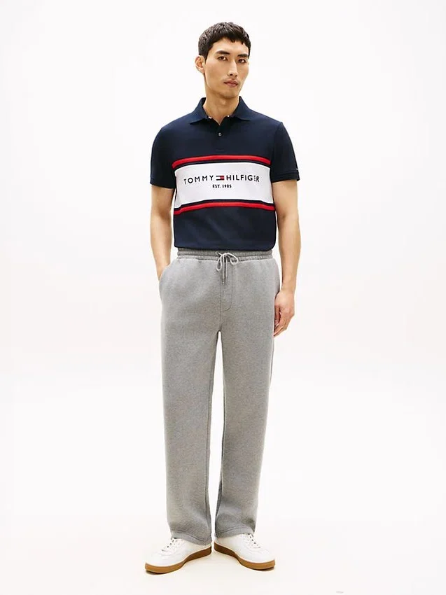 Polo de corte regular com riscas e logótipo Tommy Polo de corte regular com riscas e logótipo Tommy