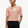 Polo de malha aberta com riscas e corte clássico Polo de malha aberta com riscas e corte clássico