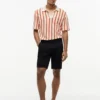 Polo de malha aberta com riscas e corte clássico Polo de malha aberta com riscas e corte clássico