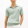 Polo de malha com tranças de manga curta Polo de malha com tranças de manga curta