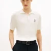 Polo de malha com tranças de manga curta Polo de malha com tranças de manga curta