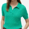 Polo de malha com tranças de manga curta Polo de malha com tranças de manga curta