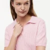 Polo de malha com tranças de manga curta Polo de malha com tranças de manga curta