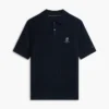 Polo de malha com tranças de manga curta Polo de malha com tranças de manga curta