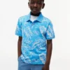 Polo elástico com estampado tropical para criança Polo elástico com estampado tropical para criança