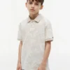 Polo elástico com estampado tropical para criança Polo elástico com estampado tropical para criança