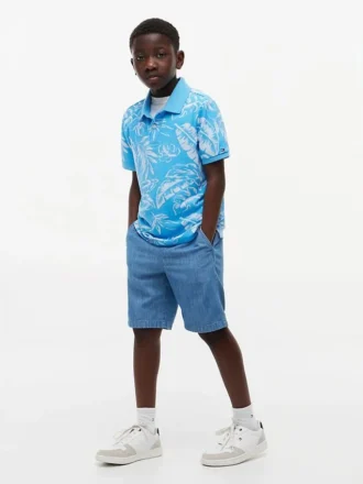 Polo elástico com estampado tropical para criança