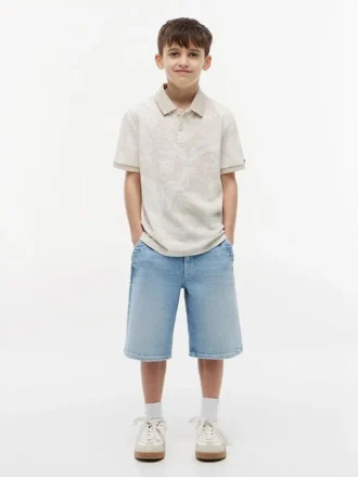 Polo elástico com estampado tropical para criança