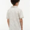 Polo elástico com estampado tropical para criança Polo elástico com estampado tropical para criança