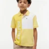 Polo elástico com logótipo em blocos de cor para criança Polo elástico com logótipo em blocos de cor para criança