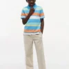 Polo elástico com riscas multicoloridas para criança Polo elástico com riscas multicoloridas para criança