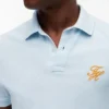 Polo em piqué com monograma em letra cursiva, corte regular Polo em piqué com monograma em letra cursiva, corte regular