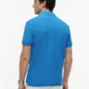 Polo em piqué com monograma em letra cursiva, corte regular Polo em piqué com monograma em letra cursiva, corte regular