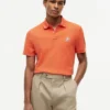 Polo em piqué com monograma em letra cursiva e corte regular Polo em piqué com monograma em letra cursiva e corte regular