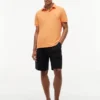 Polo Tommy com corte regular e elástico Polo Tommy com corte regular e elástico