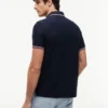 Polo Tommy Wicking de corte regular Polo Tommy Wicking de corte regular