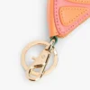 Porta-moedas em cunha laranja com pingente para mala Porta-moedas em cunha laranja com pingente para mala