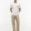 T-shirt com bolso e logótipo floral T-shirt com bolso e logótipo floral