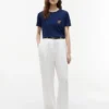 T-shirt com bolso e monograma em letra cursiva T-shirt com bolso e monograma em letra cursiva