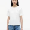 T-shirt com laço nas costas em materiais mistos T-shirt com laço nas costas em materiais mistos